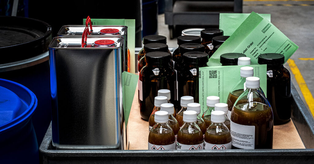 bottles of chemical sample fulfillment in a bin