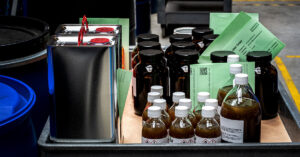 bottles of chemical sample fulfillment in a bin