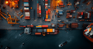 An aerial panoramic view of a thriving multimodal transportation nexus a seamlessly integrated network of highways railyards and active port facilities with freight trucks